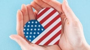 hands holding American flag