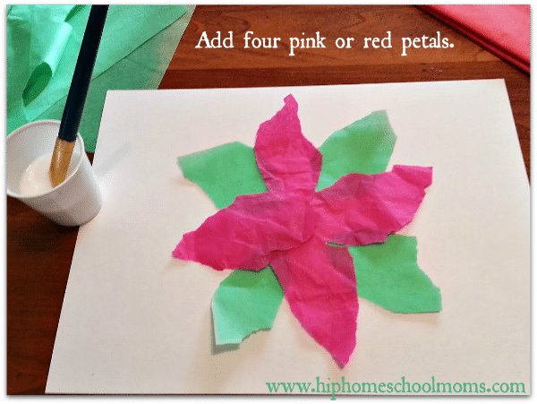 Add four pink or red tissue paper petals next. Don't glue them just yet. | Hip Homeschool Moms