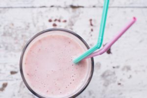 pink smoothie with straws