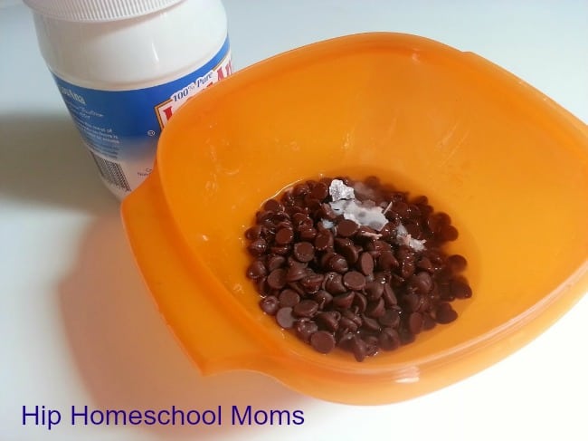Almond Joy Puppy Chow Recipe |Melt chocolate chips and coconut oil.