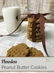 Flourless Peanut Butter Cookies Recipe a stack of cookies tied with a brown bow on a white tablecloth and a jug of milk
