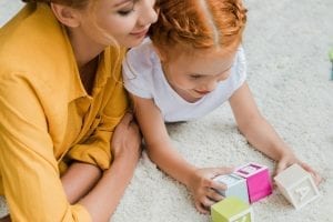 Mom and daughter playing with blocks