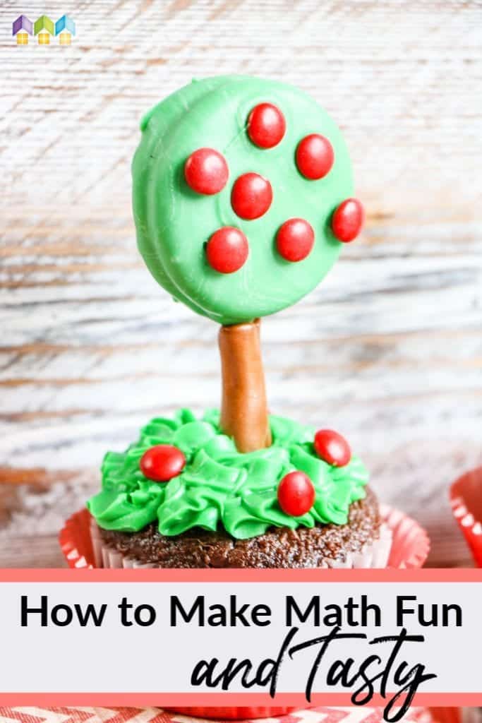 cupcake with green icing for grass, green dipped oreo cookie with red M&M apples