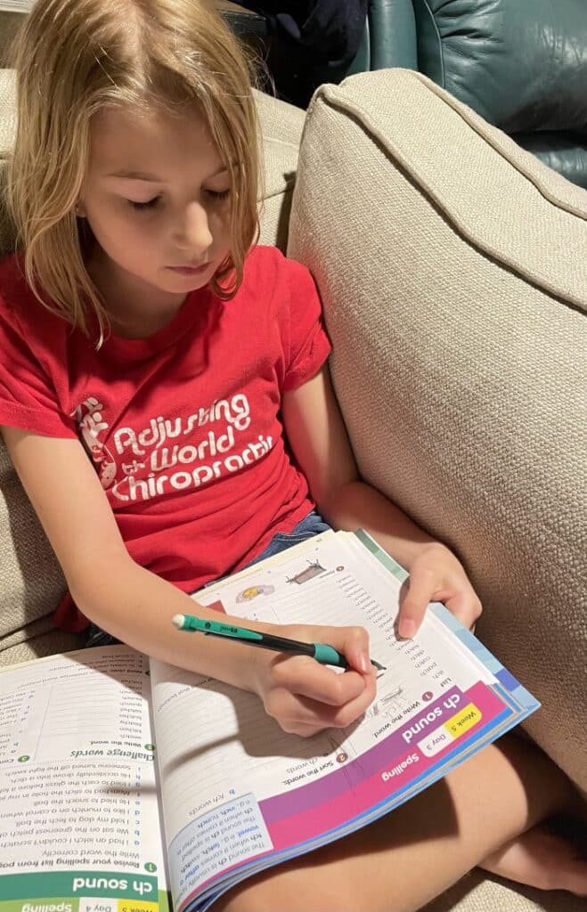 Reading Eggs review - girl using workbook